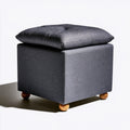 Dark gray fabric square pouf from PedestalDiningCo, versatile ottoman for living room and home decor.