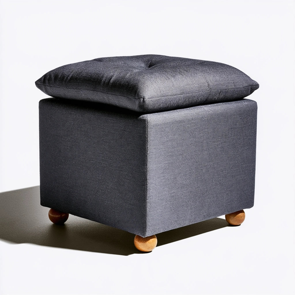 Dark gray fabric square pouf from PedestalDiningCo, versatile ottoman for living room and home decor.