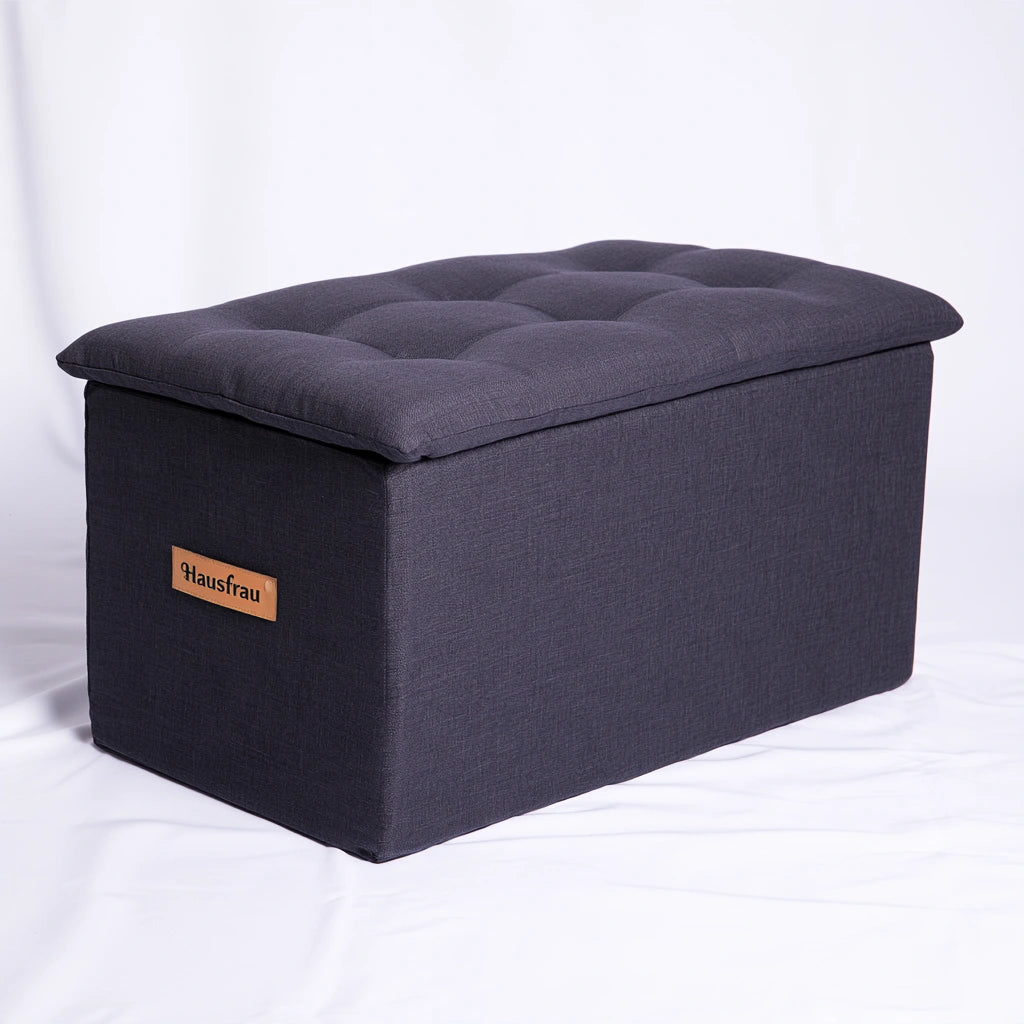 Dark grey rectangular storage bench with tufted lid, ideal for living room furniture by PedestalDiningCo.