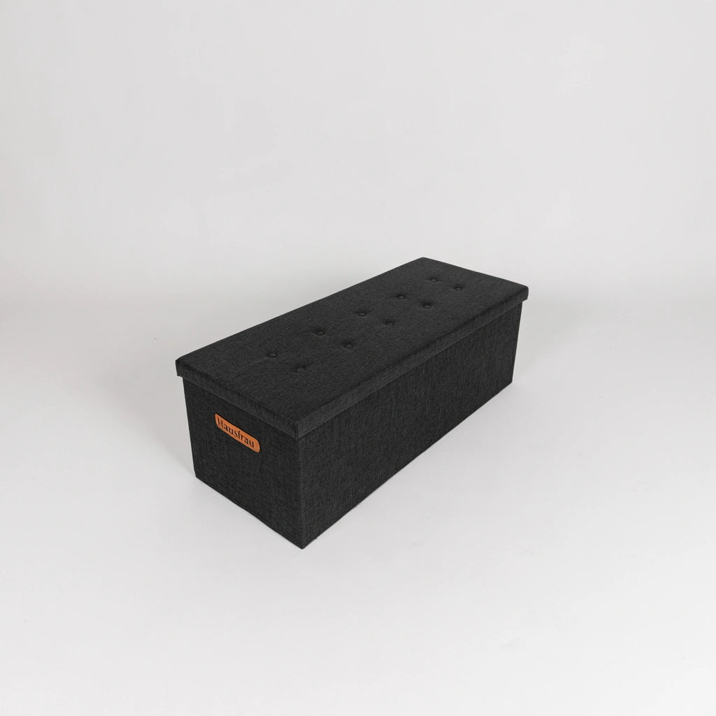 Dark grey rectangular storage bench with tufted lid, ideal for living room furniture by PedestalDiningCo.