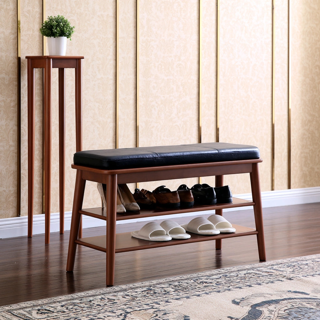 Dark wood shoe bench with black leather cushion, padded porte-shoe storage for entryway, by PedestalDiningCo.